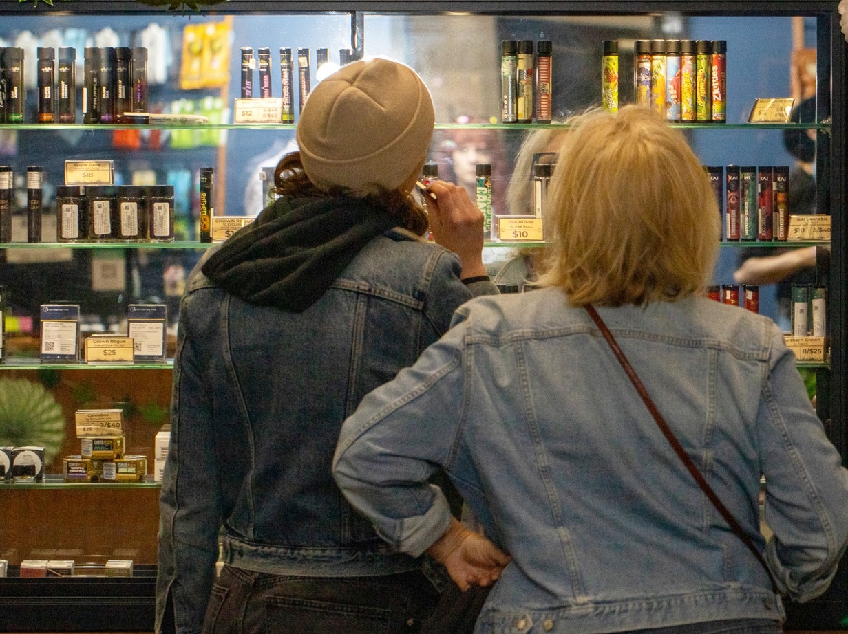Two women browsing product selections at Dunegrass.